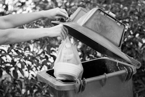 Professional waste removal service collecting garbage